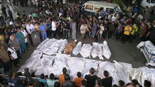 Bodies line up outside Gaza hospital as Israeli ai
