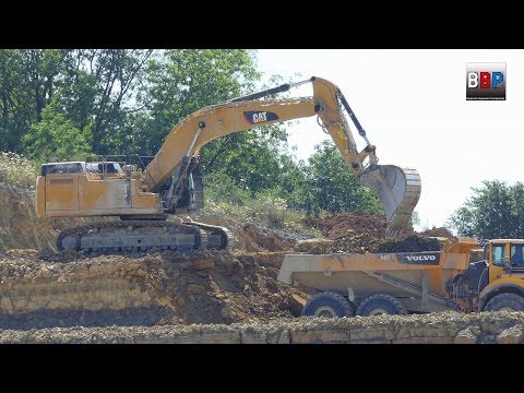 CATERPILLAR 352F Loads VOLVO A40F, Quarry / Steinbruch, Germany, 2018.