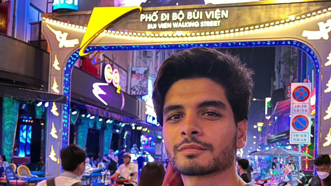 Witness the tranquility of Giac Lam Pagoda during a tourist visit.