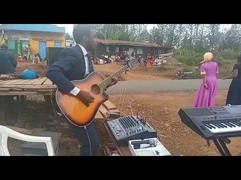 An astute guitarist during a crusade done by 7th day Church of God Meru