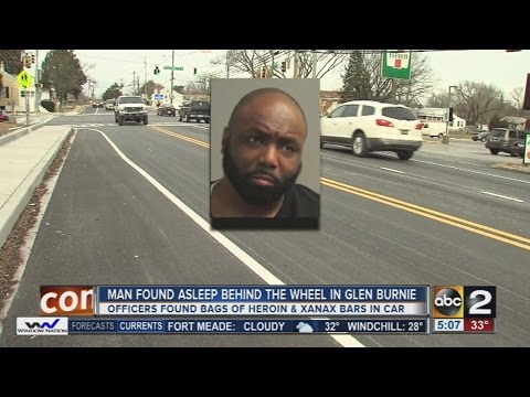 Man found asleep in his car with 24 baggies of heroin