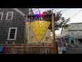 Walking on Commercial Street in Provincetown from Spiritus to the Art sign