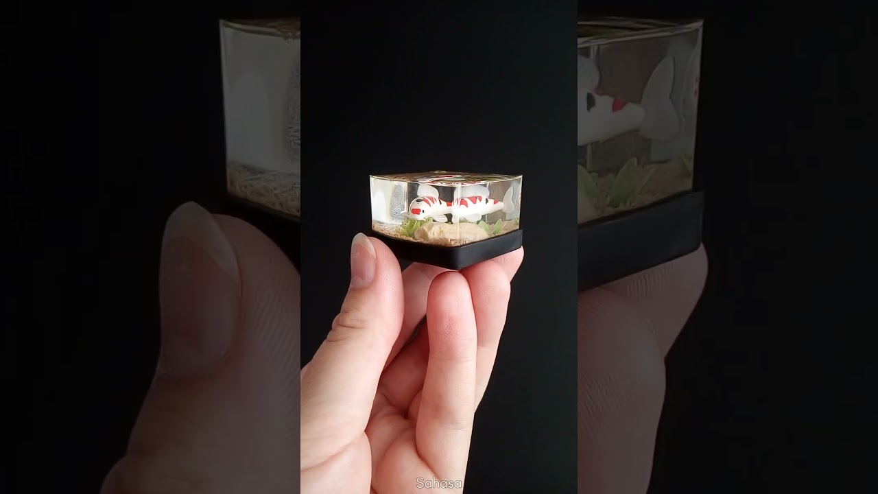 I sculpted a miniature koi from polymer clay and encased it in resin