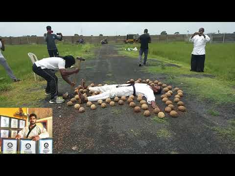 Blindfolded man smashes coconuts around another man -Guinness World Records//Prabhakar reddy
