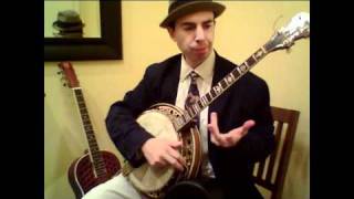 Nick Russo demonstrating guitar, tenor banjo, ukulele and mandolin