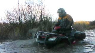 preview picture of video 'ATV Honda fighting mud with ice in a swamp near Moscow Russia (part 2)'