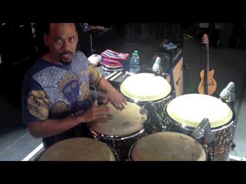 Paoli Mejias tuning congas in Santana band with Chad Tasky