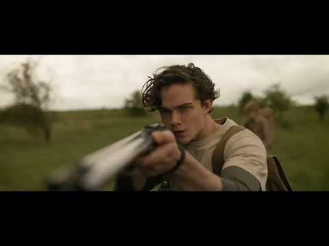 Final trailer beat: a blood-red wash across Kraven’s face as a choir recedes into drum echoes