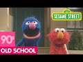 Sesame Street Grover Demonstrates Next To A Mailbox