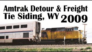 preview picture of video 'Union Pacific freight meets diverted Amtrak California Zephyr at Tie Siding, WY on July 19, 2009'