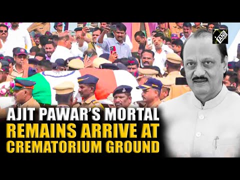 WATCH: Ajit Pawar’s mortal remains wrapped in Tricolour arrive at crematorium ground in Baramati