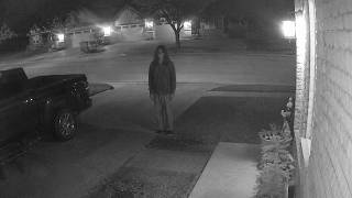 Security Camera Captures Figure Standing Outside Family’s Home