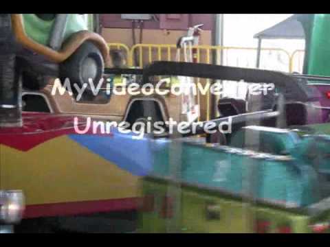 Lily enjoying amusement rides.