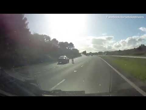 Terrifying moment cyclist is undertaken on dual carriageway