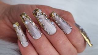 Luxury velvet cat eye nails with gold filigree french crystals and pearls. 