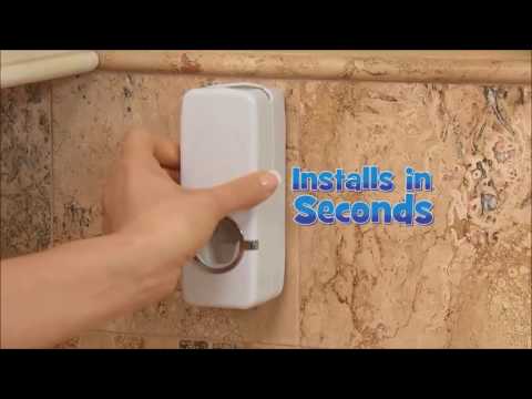 Manual toothpaste dispenser with toothbrush holder