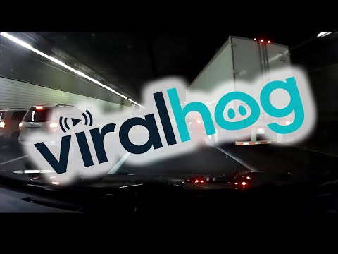 Truck Tips Over in Traffic Filled Tunnel || ViralHog