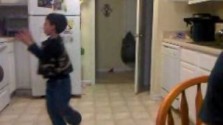 Oven mit boxing gloves and a plastic tube helmet