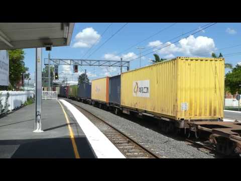 Aurizon diesel locomotive 2829 hauls a container freight train through Strathpine Station.