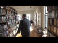 Floor to ceiling books fill Kemper's loft home