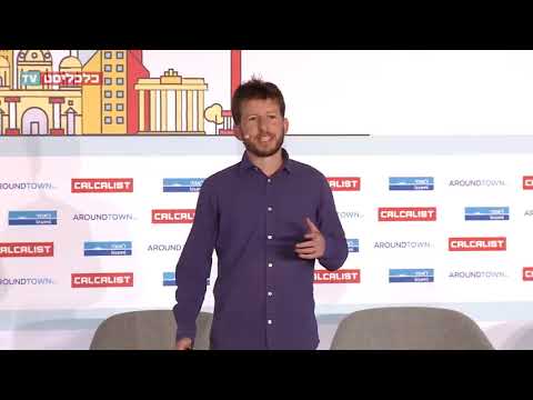 David, our co-founder, in We-Tech Berlin conference logo