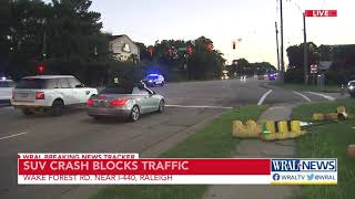 SUV swerves, hits pole on Wake Forest Road near I-440 in Raleigh