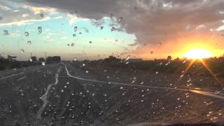 preview picture of video 'Rising Rain & Setting Sun, drive past YuCo Cotton Gin, Dome Valley, Arizona, Yuma County'