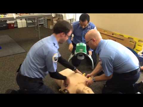 Paramedics demonstrate how to use the LUCAS 2 device