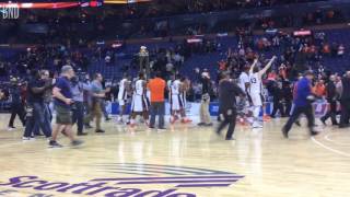 Illinois basketball star Malcolm Hill carries trophy