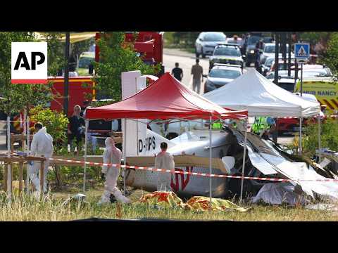 Forensic workers at the site of skydiving plane crash in France that killed 11