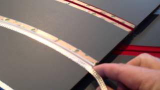 Laying slot car braid on a routed track