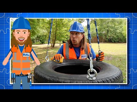 Man in blue hard hat and orange safety vest hoists a tire with a chain in a park; HAL badge visible, with a cartoon HAL character on the left.