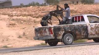 Libya rebel side. TV crew under fire.