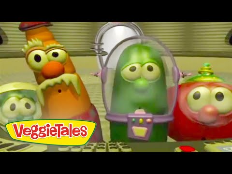 Three VeggieTales characters with large eyes in a futuristic control room; a green cucumber in a space helmet center, an orange veggie on the left and a red veggie on the right, VeggieTales logo in the corner.