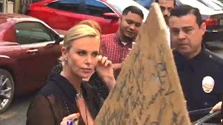 Charlie Theron Lays Down The Law For Anxious Autograph Seekers