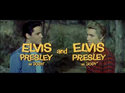 Final trailer beat: Elvis mid-song to camera; quick cut to crowd and convertible