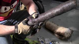 Unraveling the packing and steel wool from the pipes core