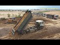 Dump trucks at work | Dump Tucks unloading dirt and bulldozer pushing dirt ឡានយីឌុបប៊ែនចាក់ដី