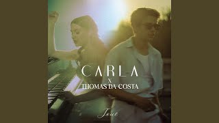 Kadr z teledysku Joué (ft. Thomas Da Costa) tekst piosenki Carla