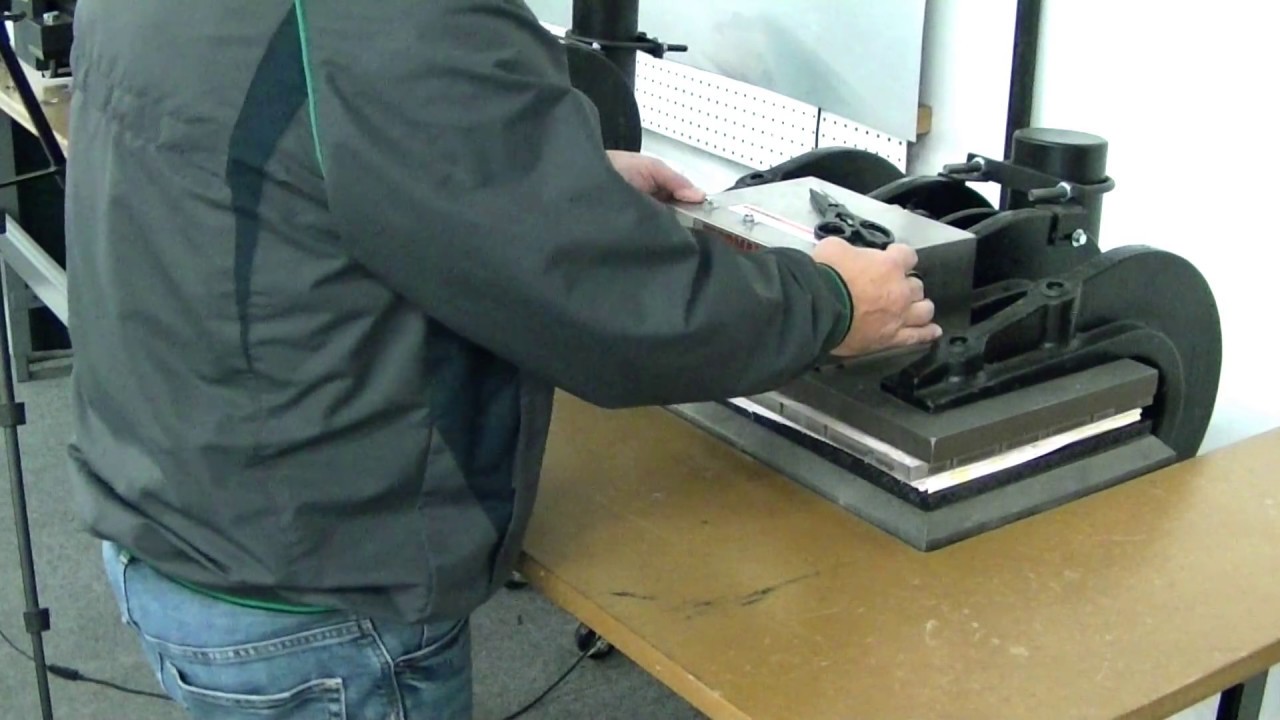 Tippmannn Clicker Steel Rule Die Cutting Press cutting fabric using a steel rule cutting die