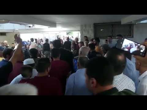 لحظة نقل د. ناصر الدين الشاعر إلى مستشفى النجاح لتلقي العلاج بعد إصابته بالرصاص