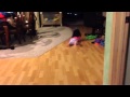 Little Girl Goes for a Swim on Wood Floor 