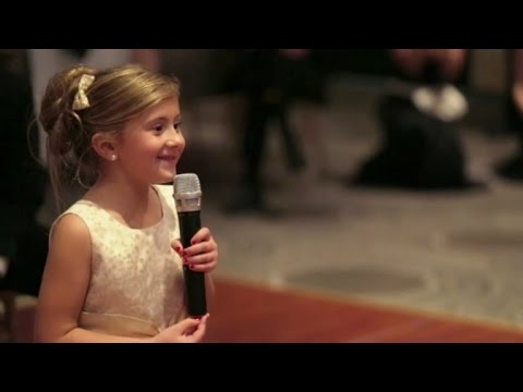 6-Year-Old Flower Girl Surprises Bride and Groom with Adorable Performance