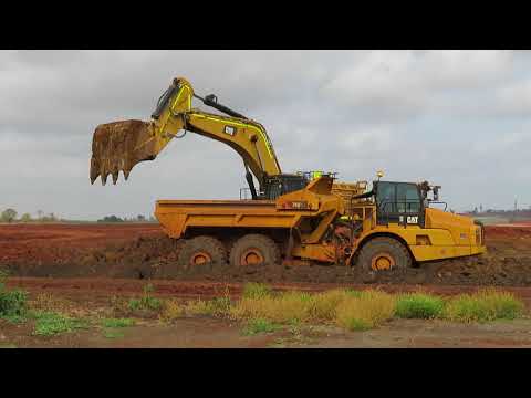 Cat 374F excavator loading Cat 740 EJ ADT