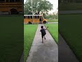 Little Boy Falls Onto Grass While Running to Catch School Bus - 1361653