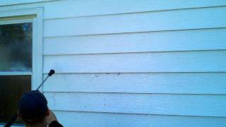 Mike Murphy power washing my house.