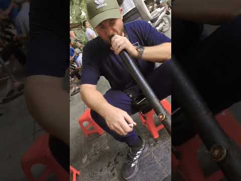 Foreigner Smoking Thuoc Lao in Hanoi Vietnam without coughing!