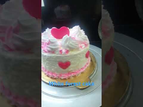 white forest cake on the occasion of anniversary beautiful cake with light shade.