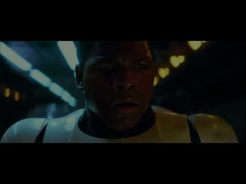 Trailer still: Rey on the steps of Ahch-To holding out the lightsaber at sunset