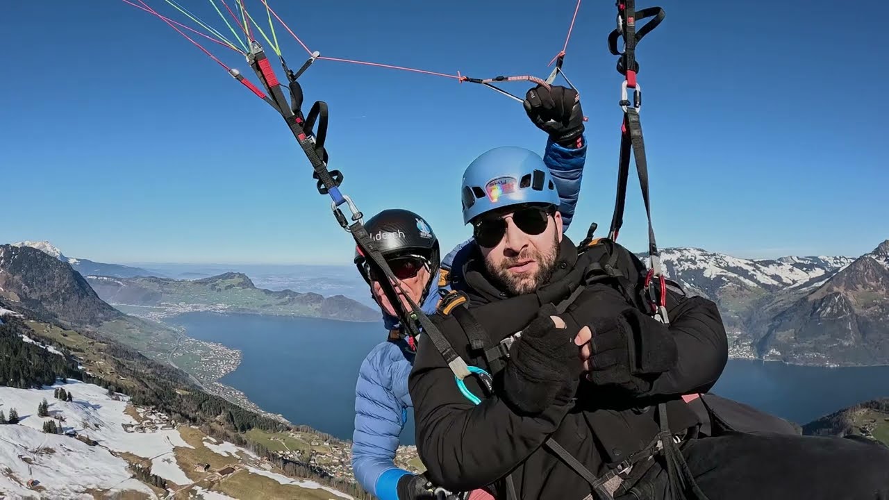 Experience the thrill as a voyager paraglides across the Lucerne.